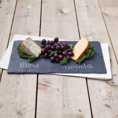 ELEGANT SLATE CHEESE BOARD - Upgrade your hors d'oeuvres presentation with this rectangular slate cheese board and chalk set. Designed with a velvet backing to protect table surfaces, this appetizer service set brings extra class to your entertaining.