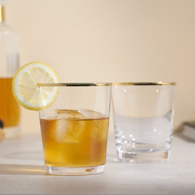 SET OF 2 GOLD RIMMED COCKTAIL TUMBLERS - These gilded lowball glasses bring a touch of gold to your favorite cocktail. Skip boring clear cocktail glasses and add some sparkle to your table with this elegant gilded glassware at your next party.
