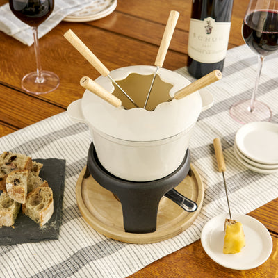 THE TRADITIONAL FONDUE EXPERIENCE can be yours with this rustic farmhouse fondue set. Enjoy the European feel of artisanal fondue, from cheese fondue to chocolate fondue. Get everyone involved at a fondue party with this kitchen accessory.
