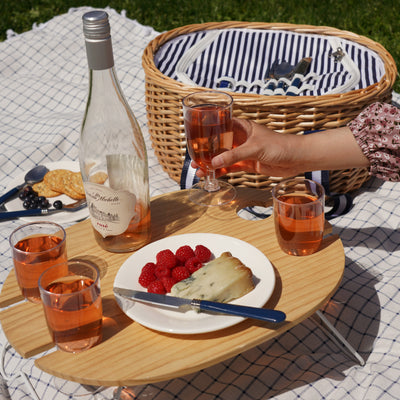 COMPLETE FOUR PERSON PICNIC BASKET SET: This outdoor picnic basket with accessories has everything you need for a picnic basket for 4 friends. Complete with 4 sets of plates, silverware, wine glasses, and cloth napkins, this white picnic basket elevates your beach day or lake party.