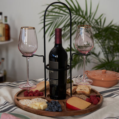 WINE FLIGHT AND SNACK TRAY: A small serving tray and wine glass holder that does double duty. This wooden tray is a great addition to your charcuterie accessories and has a wine bottle holder for a standard wine bottle and two stemmed wine glasses. 