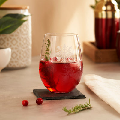TURN YOUR DRINKS INTO A WINTER WONDERLAND -  The snowflake design on this stemless tumbler is subtle, yet creates a striking effect when the glass is filled. From red wine to cranberry martinis or jingle juice punch, this scattered snowflake stemless wine glass is the perfect way to show off your holiday spirits.