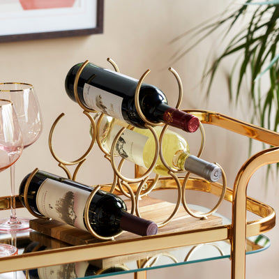 VERSATILE COUNTERTOP STORAGE - Stash this tabletop wine rack on your bar cart, kitchen counter, or in your wine cellar for a simple, elegant storage solution for your wine. The gold finish gives this wine holder an elevated feel.
