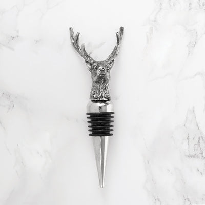 METAL STOPPER WITH RUBBER SEAL - This wine stopper combines multiple materials to create a durable stopper. The Stag is crafted from zinc alloy and is highly detailed, while the sloped stopper is made from metal with a rubber grip for a secure seal.