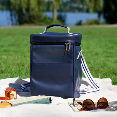 BACKPACK COOLER KEEPS DRINKS COLD ON THE GO - Never have warm drinks at a picnic again. This insulated backpack cooler bag keeps your drinks nicely chilled on a hot day with its insulated design and zipper closure. Holds 4 wine bottles.
