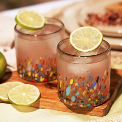 COLORFUL BEVERAGE GLASSES – Drink in style with these Mexico glasses. This set of recycled glassware is perfect for cocktails, and hand made in Mexico by glass artisans. Hand wash recommended.