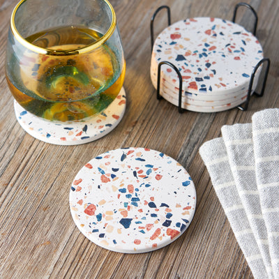 MODERN BOHO AESTHETIC TERRAZZO COASTERS - Add a modern boho chic look to your house or bar with these smooth round stoneware coasters. These coasters have a no scratch cork backing that can be placed on any kitchen table without damaging it.
