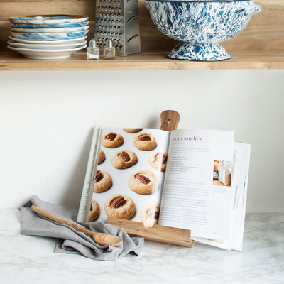 PERFECT FOR HOLDING COOKBOOKS OR TABLETS - Shaped like a cutting board with a handle, this tablet stand is ideal for holding tablets, cookbooks, or recipe cards so you can check the recipe while cooking. 8.25 x 12 inches.
