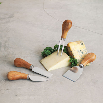FOUR ESSENTIAL CHEESE AND CHARCUTERIE TOOLS - Upgrade your cheese tastings with these stainless steel knife set, including a small spade brie knife for soft cheeses, a narrow blade, a flat chisel for hard cheeses, and a stout cheese fork.