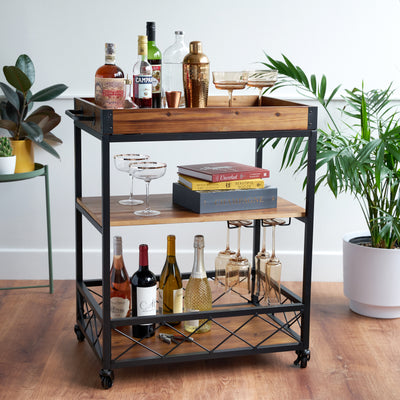 INDUSTRIAL RUSTIC WHEELED BAR CART - Store your liquor, wine, bar tools, and glassware in style. Perfect for displaying curated liquor decanters, cocktail glasses, cocktail shakers, and cocktail books, as well as serving drinks.
