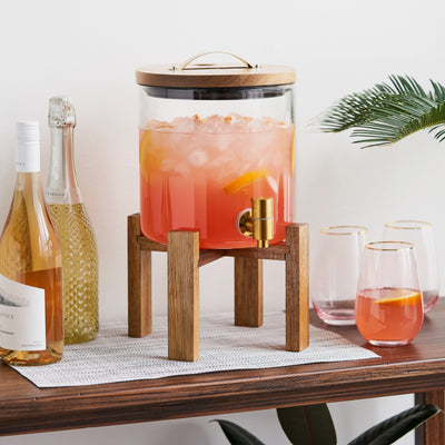 MODERN DRINK DISPENSER - Perfect for parties, backyard barbecues, or outdoor weddings, this glass drink dispenser has a modern shape and bronze spigot so guests can easily refill their drinks. Perfect for lemonade, batch margaritas, or sweet iced tea.