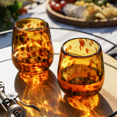 SET OF 2 RED WINE GLASSES - This amber speckled stemless wine glass set brings a unique touch to your favorite vintage. Skip boring clear wine glasses and add some color to your table with these colored wine tumblers at your next party.