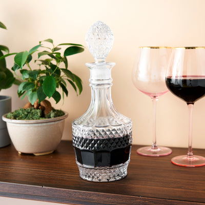 VINTAGE CRYSTAL DECANTER – Give your finest wines a decanter to match. The gem-like angles in this solid crystal decanter refract light through your alcohol, making it beautiful as well as practical. Holds 26 oz. of your favorite liquor or wine.
